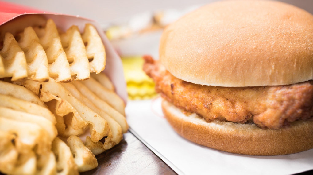 A Chick-fil-A chicken sandwich and waffle fries are pictured (Source: Chick-fil-A).
