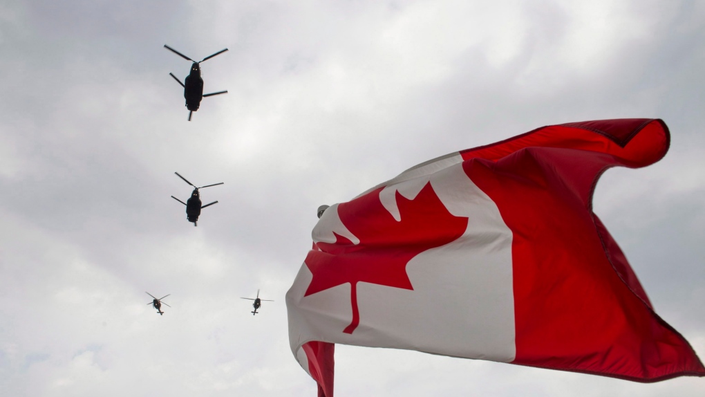 Canadian Forces CH-47 Chinook helicopters participate in a flyover of Parliament Hill in Ottawa on Friday, May 9, 2014. (THE CANADIAN PRESS/Justin Tang)