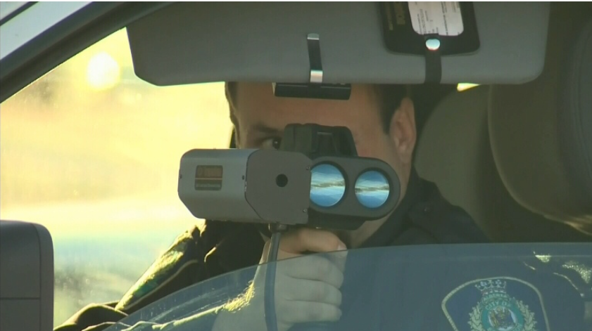 An Edmonton traffic enforcement peace officer scans for speeders (CTV News)
