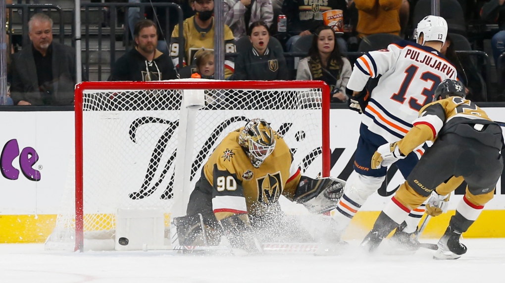 Edmonton Oilers right wing Jesse Puljujarvi (13) scores a goal past Vegas Golden Knights goaltender Robin Lehner (90) during the second period of an NHL hockey game Saturday, Nov. 27, 2021, in Las Vegas. (AP Photo/Chase Stevens) 
