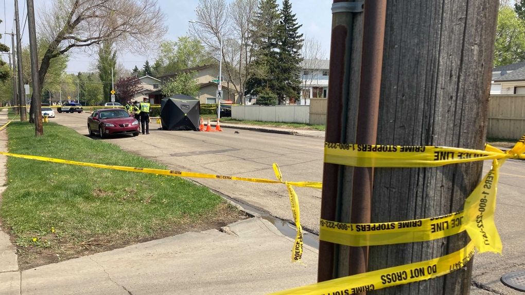 Police tape ropes off the scene of a fatal collision involving a pedestrian and a vehicle in the area of 129 Avenue and 126 Street Friday afternoon. May 21, 2021 (CTV News Edmonton/ Brandon Lynch)