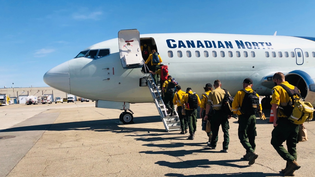 Alberta Wildfire personnel board a plane Monday morning bound for northern Ontario (Source: Alberta Wildfire)