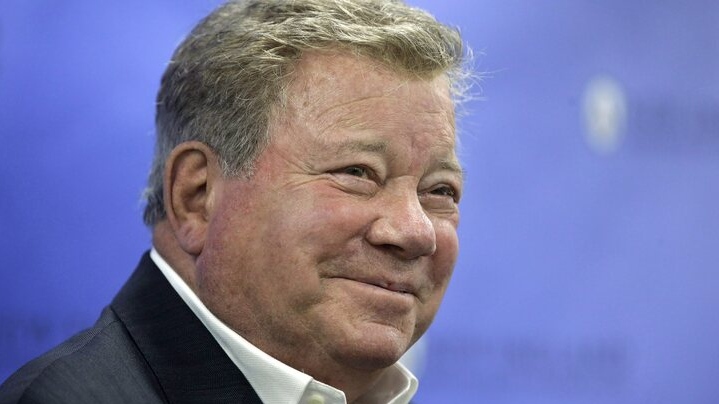 Actor William Shatner smiles while taking questions from reporters, Sunday, May 6, 2018, after delivering the commencement address at New England Institute of Technology graduation ceremonies, in Providence, R.I. Shatner was presented with an honorary doctor of humane letters degree during the event. (AP Photo/Steven Senne)