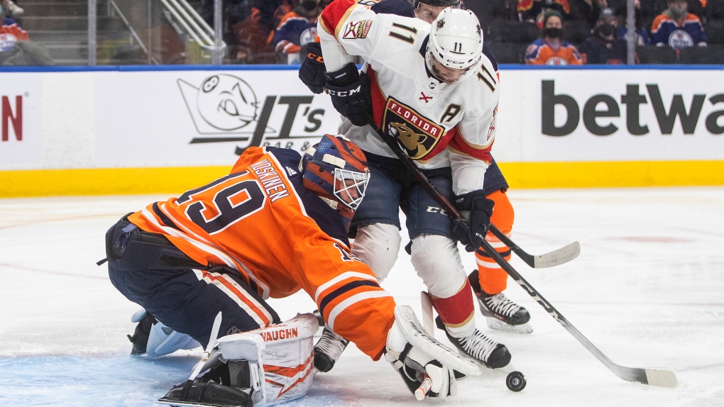 Florida Panthers' Jonathan Huberdeau (11) is stopped by Edmonton Oilers goalie Mikko Koskinen (19) during first period NHL action in Edmonton on Thursday, January 20, 2022 (The Canadian Press/Jason Franson).