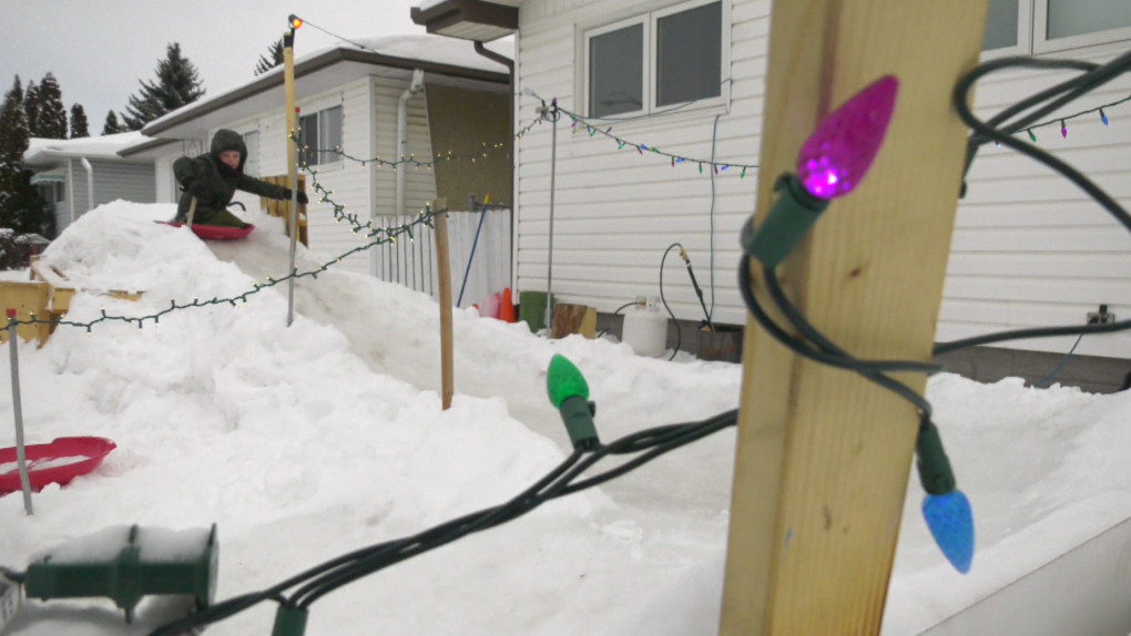 An Edmonton man has turned his front yard into a snow slide.