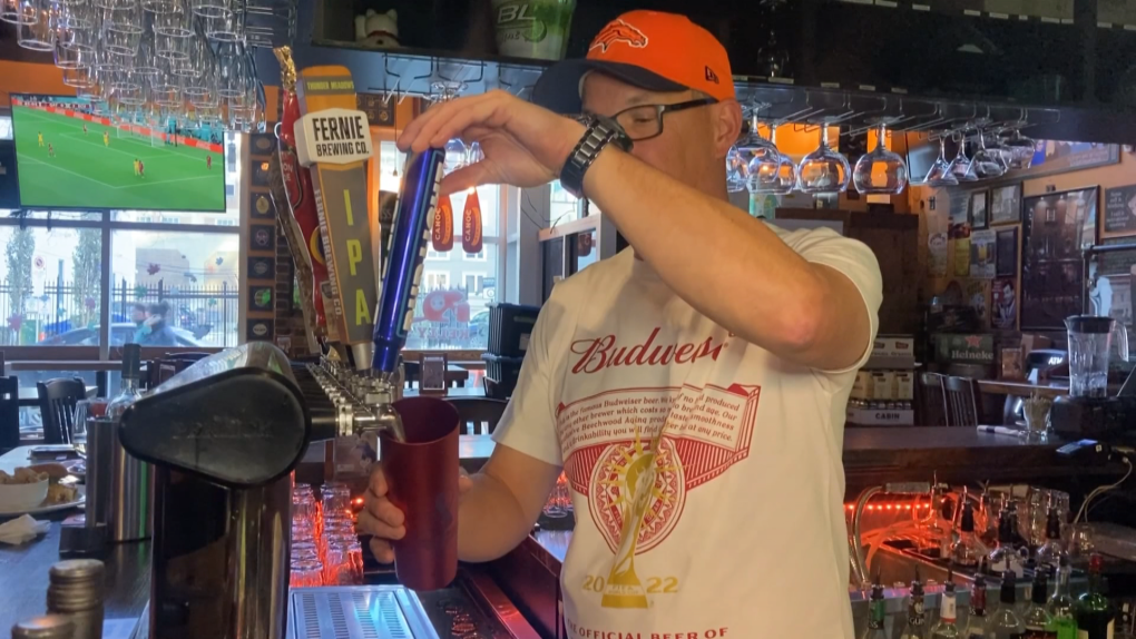 Scott Krebes pours a beer at Kelly's Pub in Edmonton.