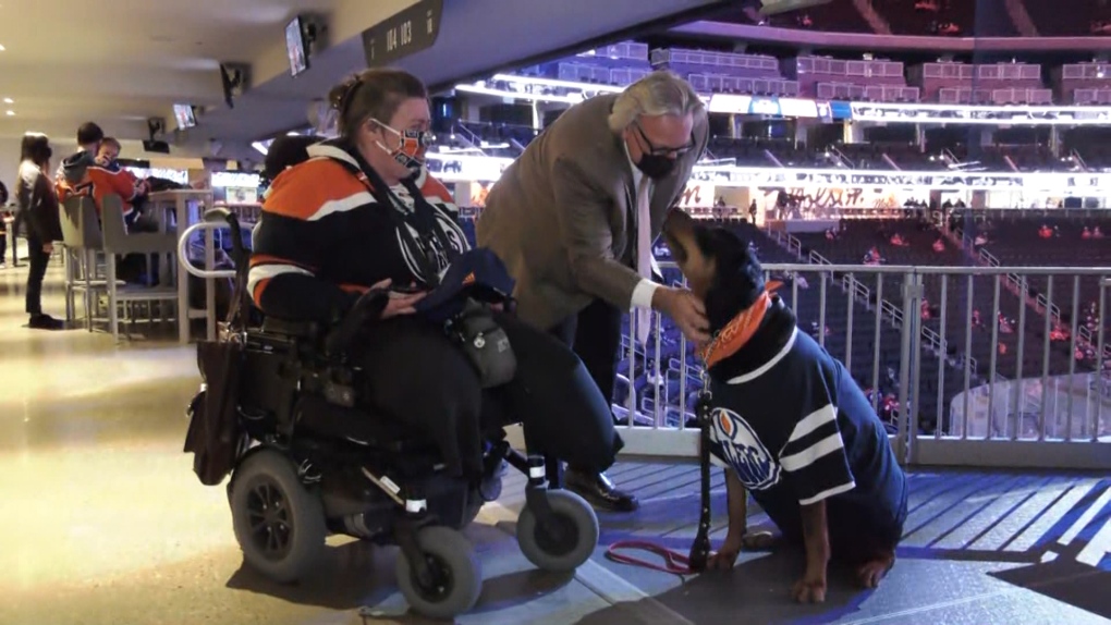 Marla Smith, Kuno and Glenn Anderson at the Oilers game Tuesday night. Feb. 08, 2022. (CTV News Edmonton)