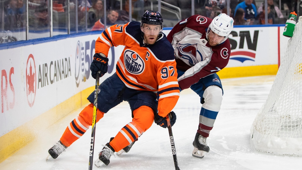 Colorado Avalanche defenceman Devon Toews (7) chases Edmonton Oilers' Connor McDavid (97) during second period NHL action in Edmonton on Saturday, April 9, 2022.THE CANADIAN PRESS/Jason Franson