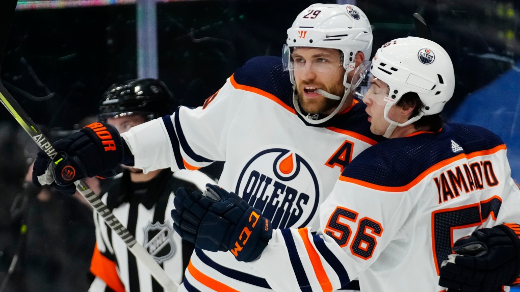 Edmonton Oilers' Leon Draisaitl (29) celebrates his goal against the Toronto Maple Leafs with teammate Kailer Yamamoto (56) during first period NHL hockey action in Toronto on Wednesday, January 5, 2022 (The Canadian Press/Frank Gunn).