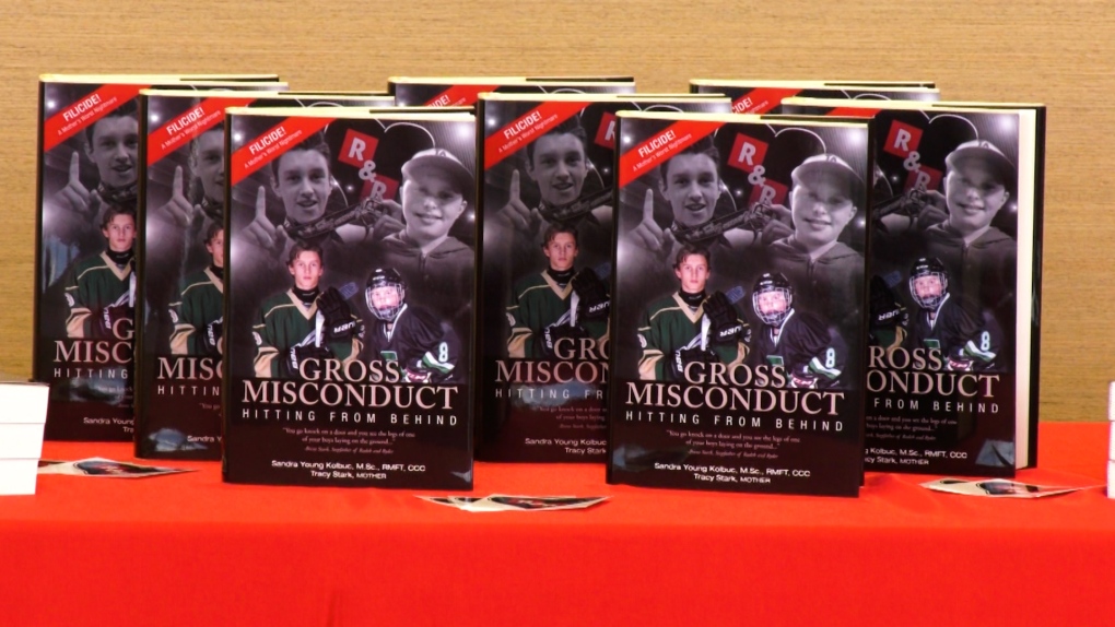 The book Gross Misconduct: Hitting From Behind at a launch event in Edmonton on Saturday May 14, 2022. (CTV News Edmonton)
