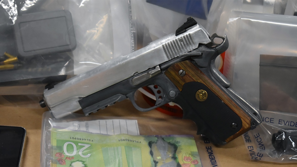 Police seized a loaded gun along with some drugs and cash during a traffic stop in Red Deer on May 4, 2022. (Source: ALERT)