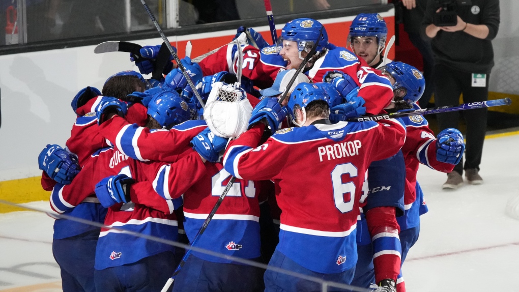 Members of the Edmonton Oil Kings celebrate their overtime-win against the Saint John Sea Dogs during Memorial Cup hockey action in Saint John, N.B. on Wednesday, June 22, 2022. THE CANADIAN PRESS/Darren Calabrese