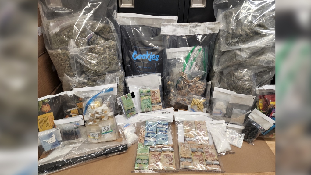 Drugs and cash seized in a bust in northern Alberta. (Supplied: RCMP)