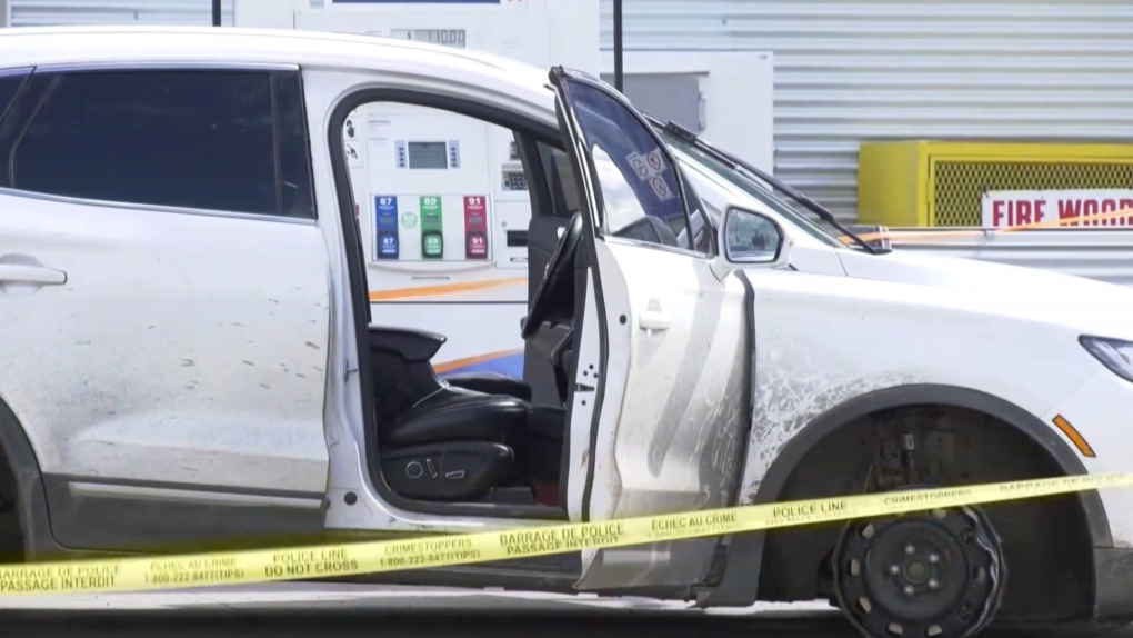 A white SUV sits at a Smoky Lake gas station. It's part of an investigation into a police shooting that killed one person.