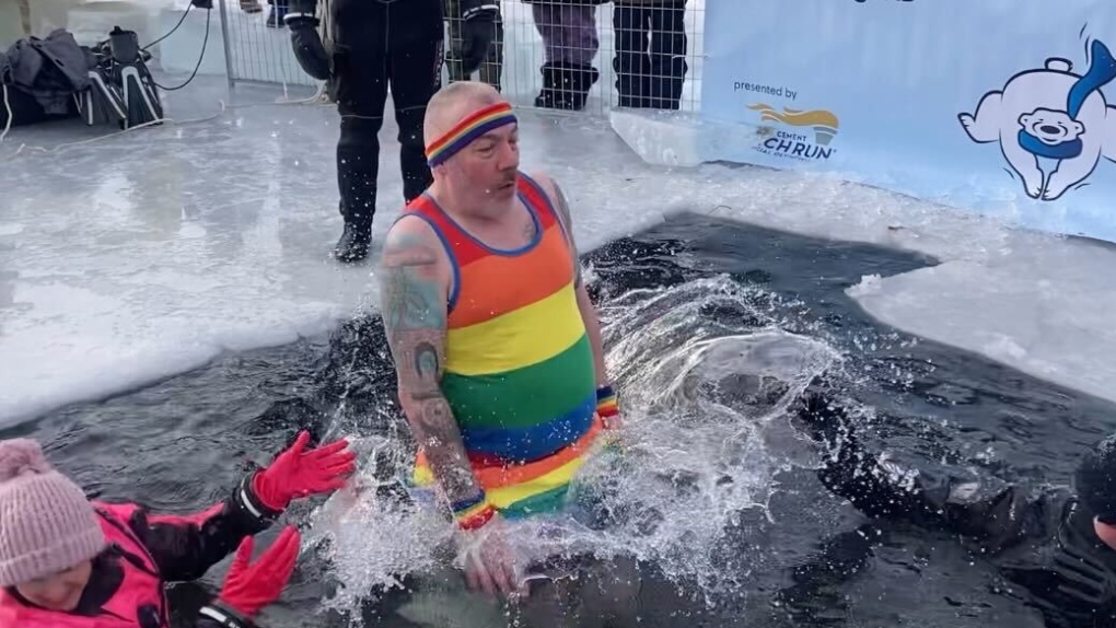 John McDougall plunges into freezing Lake Summerside in support of Special Olympics Alberta on Sunday, Jan. 29, 2023 (CTV News Edmonton/Dave Mitchell).