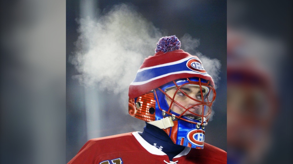 Steam rises from Montreal Canadiens goalie Jose Theodore during the second period of NHL outdoor action against the Edmonton Oilers at Commonwealth Stadium in Edmonton on Saturday Nov. 22, 2003. (CP PHOTO/Tom Hanson)
