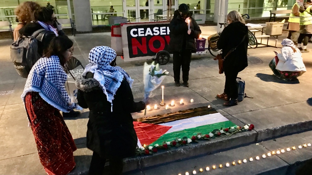 Dozens of people attend a vigil staged by the group Students for Justice in Palestine on Nov. 21, 2023, at Edmonton's University of Alberta main campus. (Sean Amato/CTV News Edmonton)