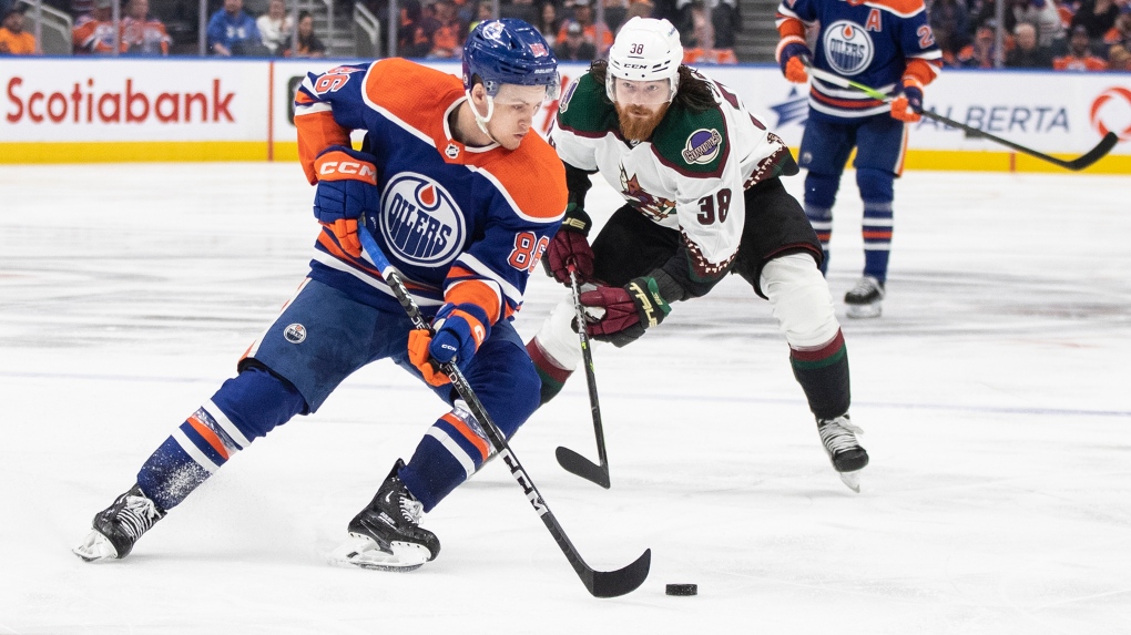 Arizona Coyotes' Liam O'Brien (38) chases Edmonton Oilers' Philip Broberg (86) during third period NHL action in Edmonton on Wednesday March 22, 2023.THE CANADIAN PRESS/Jason Franson