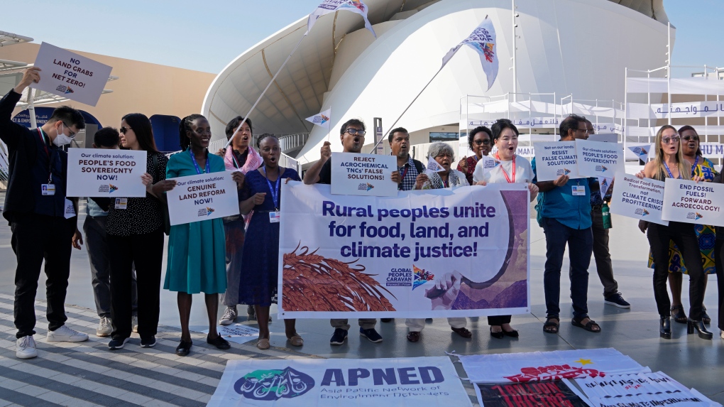 Activists demonstrate at the COP28 U.N. Climate Summit, Wednesday, Dec. 6, 2023, in Dubai, United Arab Emirates. (AP Photo/Kamran Jebreili)