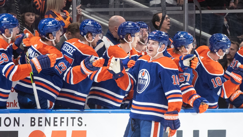 Edmonton Oilers' Zach Hyman (18) celebrates a goal against the Carolina Hurricanes during first period NHL action in Edmonton on Wednesday, December 6, 2023.THE CANADIAN PRESS/Jason Franson