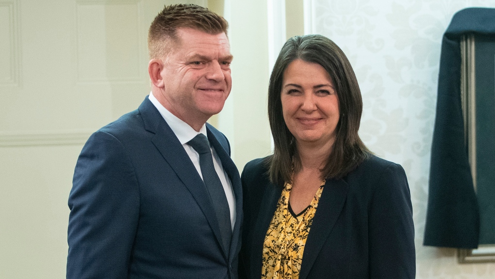 Brian Jean stands with Alberta Premier Danielle Smith after being sworn into cabinet as Jobs, Economy and Northern Development in Edmonton, Monday, Oct. 24, 2022. THE CANADIAN PRESS/Jason Franson