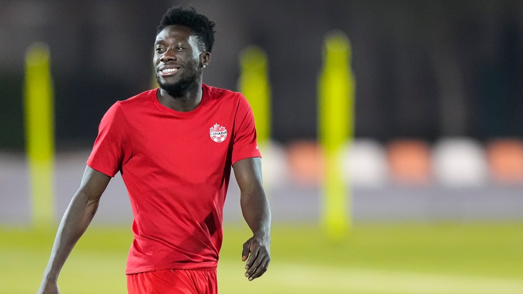 Canada star Alphonso Davies laughs during practice at the World Cup in Doha, Qatar, Friday, Nov. 25, 2022. THE CANADIAN PRESS/Nathan Denette