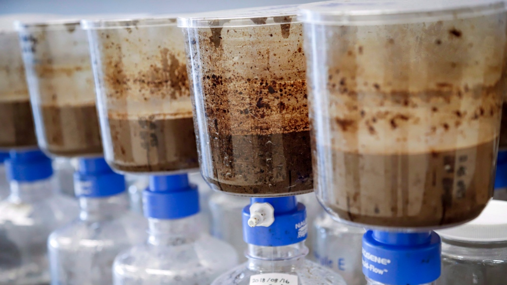 Tailings samples are being tested during a tour of Imperial's oil sands research centre in Calgary, Alta., Tuesday, Aug. 28, 2018. Recent leaks of toxic tailings from northern Alberta oilsands mines have revealed serious flaws in how Canada and Alberta look after the environment, observers say. (THE CANADIAN PRESS/Jeff McIntosh)