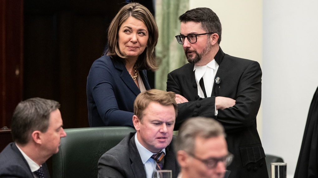 Alberta Premier Danielle Smith chats with Speaker of the House Nathan Cooper before the 2023 budget, in Edmonton on Tuesday, February 28, 2023. THE CANADIAN PRESS/Jason Franson