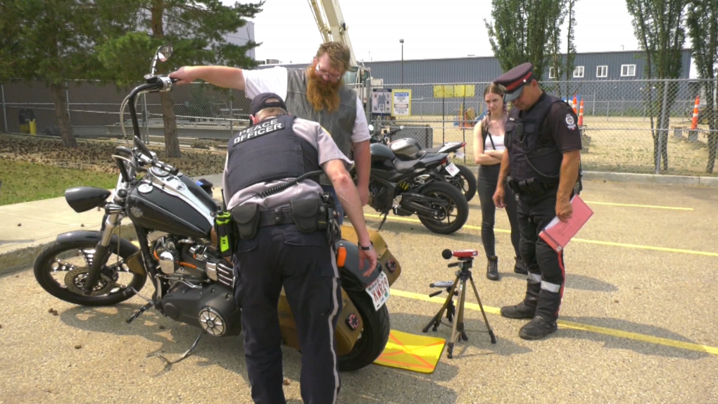 Edmonton police check the noise level of a motorcycle at a Project Tensor Amnesty Testing Event on June 10, 2023. 