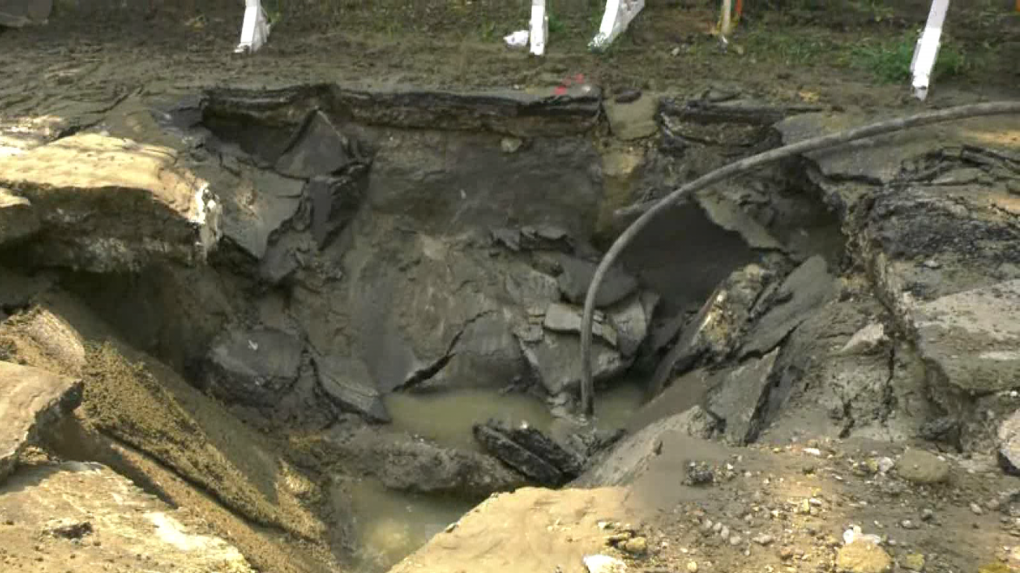 Sinkhole swallows Edmonton car, driver | CTV News