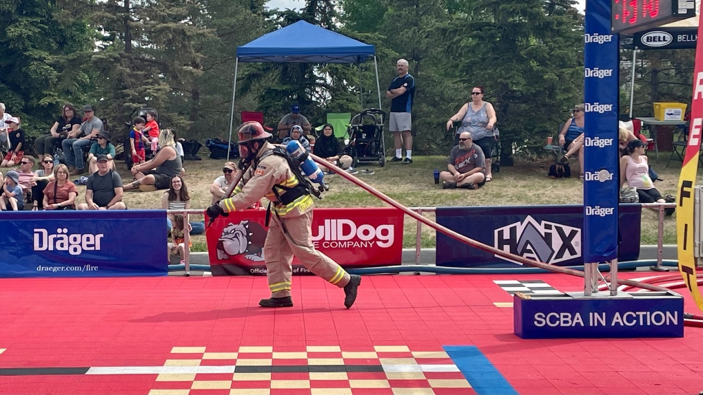 A firefighter races his way through an skill-testing obstacle course at the 2023 FireFit Alberta/Yukon Regional Championship in Edmonton on Saturday. (John Hanson/CTV News Edmonton)