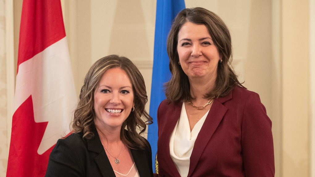 Alberta Premier Danielle Smith and Minister of Environment and Protected Areas Rebecca Schulz stand together during the swearing in of her cabinet, in Edmonton, Friday, June 9, 2023. THE CANADIAN PRESS/Jason Franson.