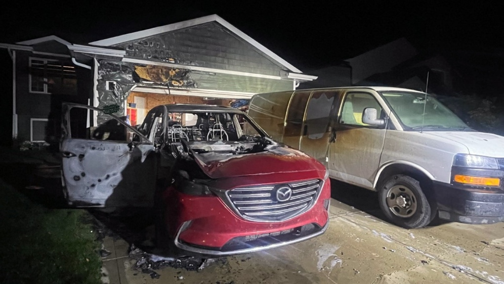 A deliberately-set vehicle fire in Red Deer spread to a van and a house on Sept. 13, 2023. (Credit: RCMP)