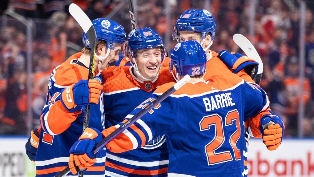 Edmonton Oilers' Ryan McLeod (71), Dylan Holloway (55), Philip Broberg (86) and Tyson Barrie (22) celebrate a goal against the New York Islanders during second period NHL action in Edmonton on Thursday January 5, 2023.THE CANADIAN PRESS/Jason Franson