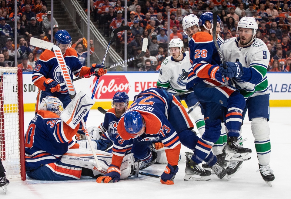 Oilers and Canucks crash net